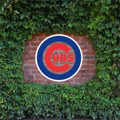 Cubs logo over Wrigely Field vines
